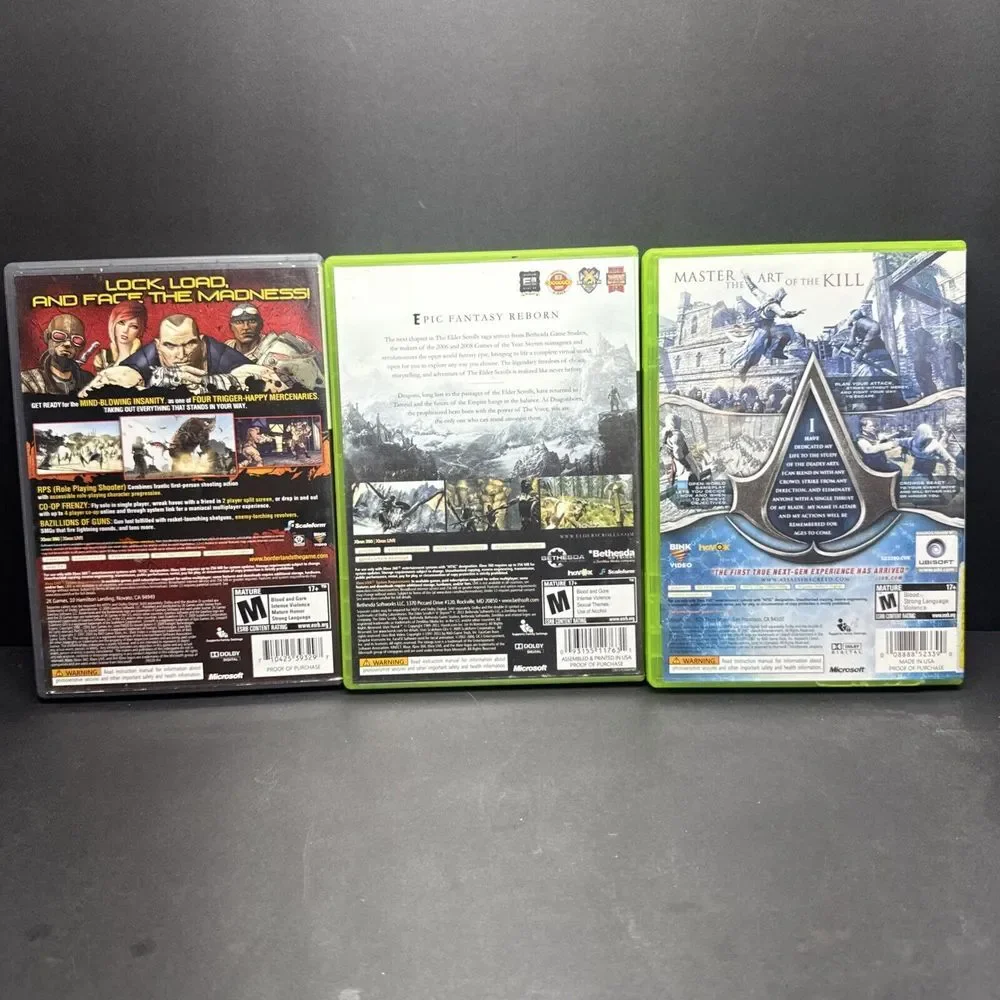 xbox  game lot Borderlands,‎ Assassin's Creed, Skyrim